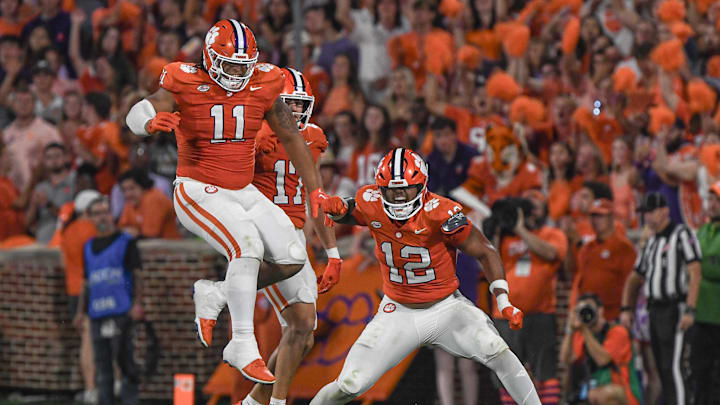 Sep 16, 2023; Clemson, South Carolina; Clemson defensive lineman T.J. Parker (12) reacts with defensive lineman Peter Woods (11) after sacking Florida Atlantic quarterback Daniel Richardson (10) during the second quarter against Florida Atlantic at Memorial Stadium.  Mandatory Credit: Ken Ruinard-USA TODAY NETWORK