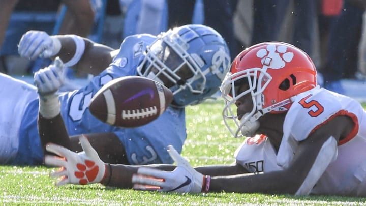 Clemson wide receiver Tee Higgins (5) nearly catches a ball near North Carolina linebacker Dominique Ross during the third quarter at Kenan Memorial Stadium in Chapel Hill, North Carolina Saturday, September 28, 2019.

Clemson Unc 1st Half