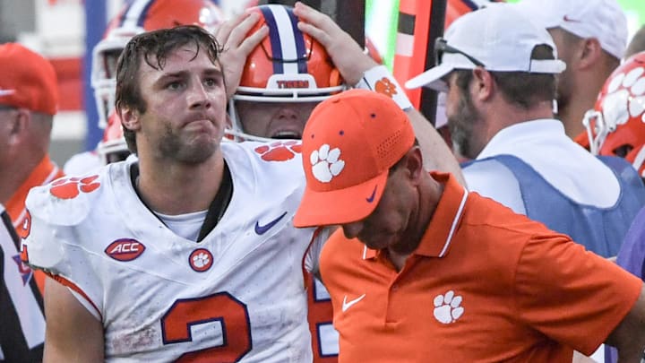 Oct 28, 2023; Raleigh, North Carolina, USA; Clemson Tigers quarterback Cade Klubnik (2) and head coach Dabo Swinney react after a game against the North Carolina State Wolfpack at Carter-Finley Stadium. North Carolina State won 24-17. Mandatory Credit: Ken Ruinard-Imagn Images Oct 28, 2023; Raleigh, North Carolina, USA; Clemson Tigers quarterback Cade Klubnik (2) and head coach Dabo Swinney react after a game against the North Carolina State Wolfpack at Carter-Finley Stadium. North Carolina State won 24-17. Mandatory Credit: Ken Ruinard-Imagn Images