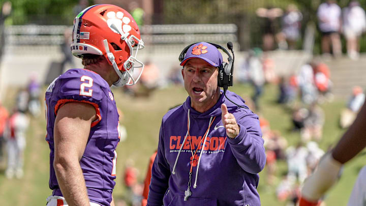 Clemson quarterback Tait Reynolds (2) listens to Clemson head coach Dabo Swinney during the first half at the annnual Clemson Orange and White spring game at Memorial Stadium in Clemson, South Carolina Saturday, March 28, 2026. Clemson quarterback Tait Reynolds (2) listens to Clemson head coach Dabo Swinney during the first half at the annnual Clemson Orange and White spring game at Memorial Stadium in Clemson, South Carolina Saturday, March 28, 2026.