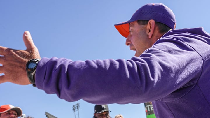 Clemson head coach Dabo Swinney waves to fans and greets them at Tiger Walk before the annnual Clemson Orange and White spring game at Memorial Stadium in Clemson, South Carolina Saturday, March 28, 2026.