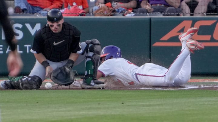Clemson infielder Tryston McCladdie (4) scores near USC Upstate sophomore Tyler Lang (4) during the bottom of the second inning at Doug Kingsmore Stadium in Clemson, S.C. Tuesday, April 21, 2026.