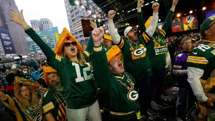 Green Bay Packers fans yell as their pick is made in the second round of 2024 NFL draft in Detroit on Friday, April 26, 2024.