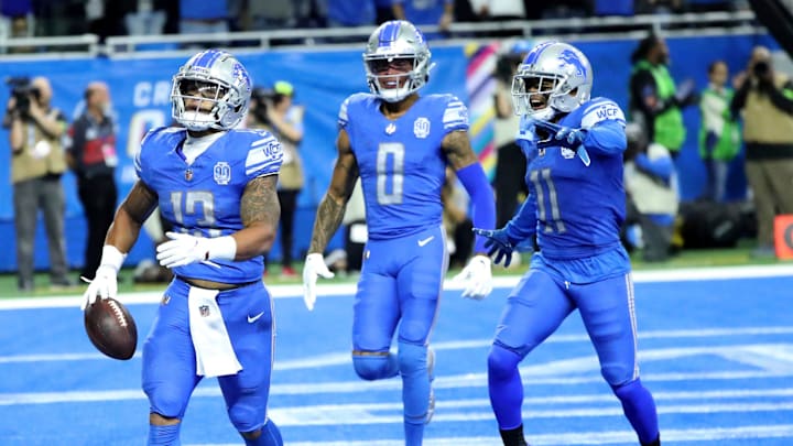 Marvin Jones Jr. (0) and Kalif Raymond (11) celebrate with Detroit Lions running back Craig Reynolds