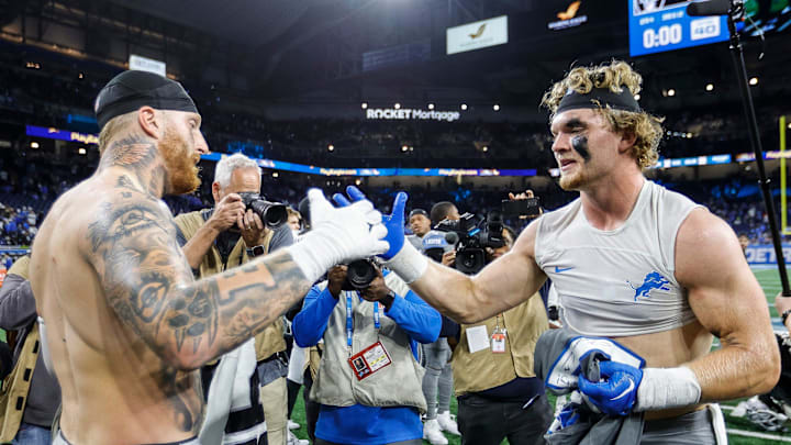 Detroit Lions defensive end Aidan Hutchinson, right, and Las Vegas Raiders defensive end Maxx Crosby exchange jerseys after the Lions' 26-14 win at Ford Field in Detroit on Monday, Oct. 30, 2023.