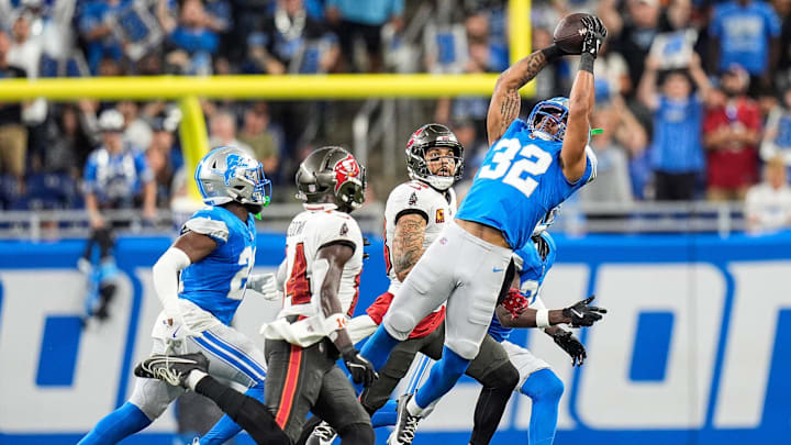 Detroit Lions safety Brian Branch (32) intercepts a pass intended for Tampa Bay Buccaneers wide receiver Chris Godwin (14) during the first half at Ford Field in Detroit on Sunday, September 15, 2024.