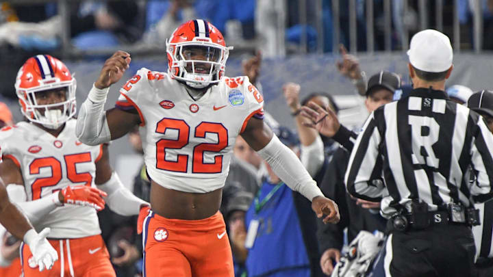 Clemson linebacker Trenton Simpson (22) reacts after tackling North Carolina quarterback Drake Maye