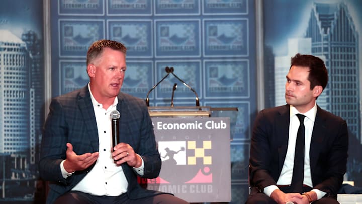 Tigers manager A.J. Hinch, left, talks with the crowd as Tigers president Scott Harris listens to