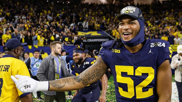 Michigan defensive end Kechaun Bennett (52) celebrates after the 34-13 win over Washington to win the national championship at NRG Stadium in Houston on Monday, Jan. 8, 2024. Michigan defensive end Kechaun Bennett (52) celebrates after the 34-13 win over Washington to win the national championship at NRG Stadium in Houston on Monday, Jan. 8, 2024.