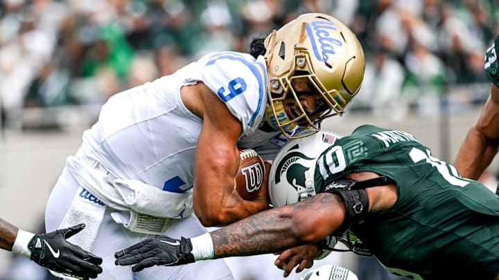 Michigan State's Wayne Matthews III, right, tackles UCLA's Nico Iamaleava during the second quarter on Saturday, Oct. 11, 2025, at Spartan Stadium in East Lansing.
