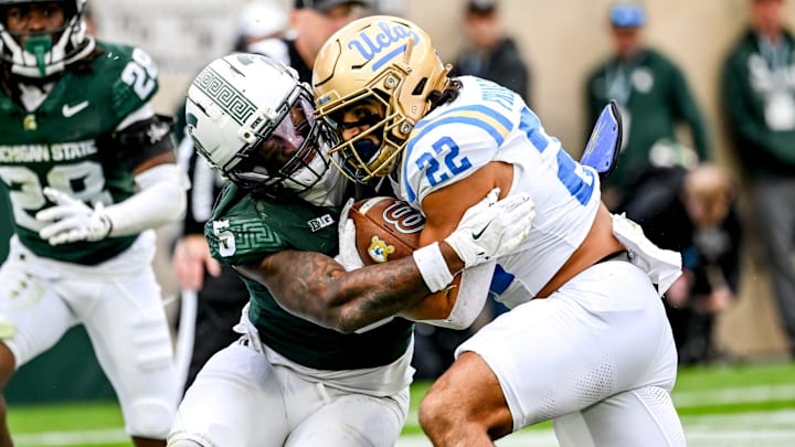 Michigan State's Jordan Hall, left, tackles UCLA's Anthony Frias II during the third quarter on Saturday, Oct. 11, 2025, at Spartan Stadium in East Lansing. Michigan State's Jordan Hall, left, tackles UCLA's Anthony Frias II during the third quarter on Saturday, Oct. 11, 2025, at Spartan Stadium in East Lansing.