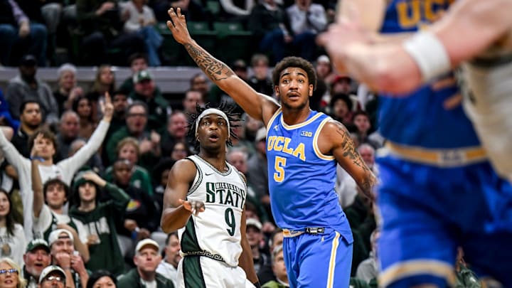 Michigan State's Trey Fort, left, watches as his 3-pointer is good against UCLA's Brandon Williams during the first half on Tuesday, Feb. 17, 2026, at the Breslin Center in East Lansing.