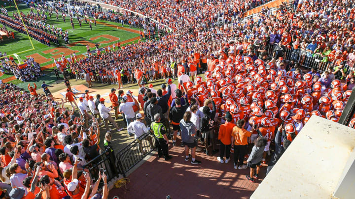Clemson players run down the hill before the game with UNC, during senior day ceremonies, Nov 18, 2023; Clemson, South Carolina, USA; at Memorial Stadium.