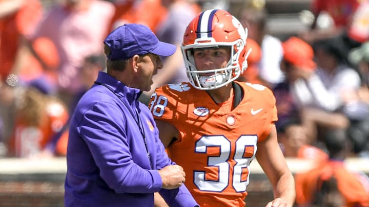 Apr 6, 2024; Clemson, South Carolina, USA; Clemson during the fourth quarter head coach Dabo Swinney talks with kicker Robert Gunn III (38) during the Clemson spring football game at Memorial Stadium. 