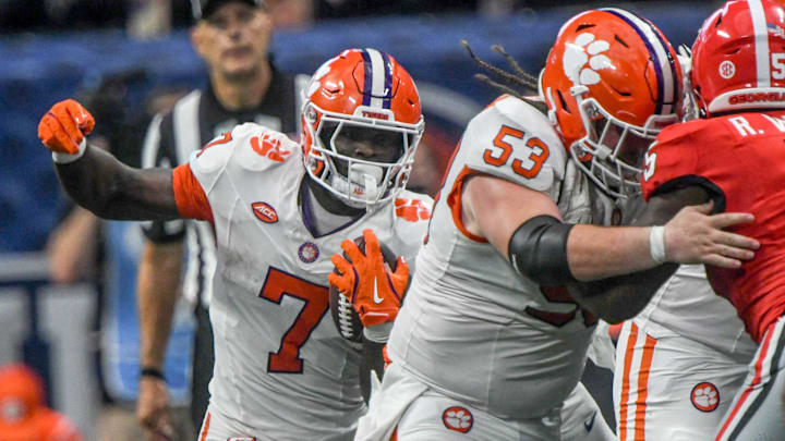Aug 31, 2024; Atlanta, Georgia, USA; Clemson Tigers running back Phil Mafah (7) runs behind offensive lineman Ryan Linthicum (53) against the Georgia Bulldogs during the third quarter of the 2024 Aflac Kickoff Game at Mercedes-Benz Stadium. 