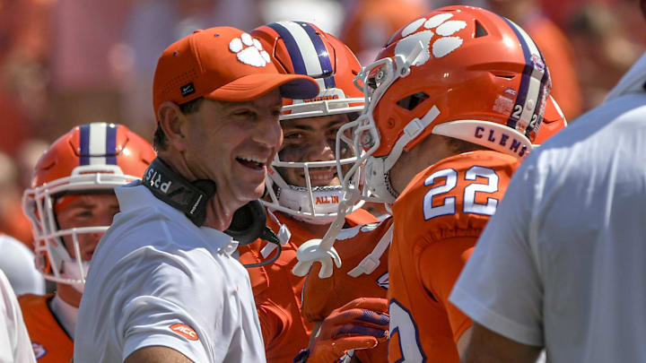 Sep 21, 2024; Clemson, South Carolina, USA; Clemson Tigers wide receiver Cole Turner (22) celebrates with head coach Dabo Swinney after scoring a touchdown against the North Carolina State Wolfpack during the second quarter at Memorial Stadium. Sep 21, 2024; Clemson, South Carolina, USA; Clemson Tigers wide receiver Cole Turner (22) celebrates with head coach Dabo Swinney after scoring a touchdown against the North Carolina State Wolfpack during the second quarter at Memorial Stadium.