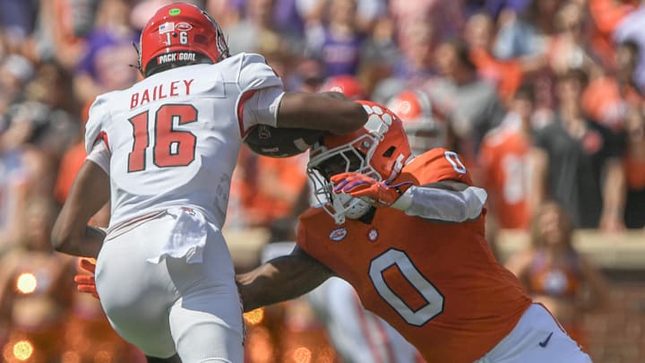 Sep 21, 2024; Clemson, South Carolina, USA; Clemson Tigers linebacker Barrett Carter (0) tackles North Carolina State Wolfpack University quarterback CJ Bailey (16) during the first quarter at Memorial Stadium. Sep 21, 2024; Clemson, South Carolina, USA; Clemson Tigers linebacker Barrett Carter (0) tackles North Carolina State Wolfpack University quarterback CJ Bailey (16) during the first quarter at Memorial Stadium.