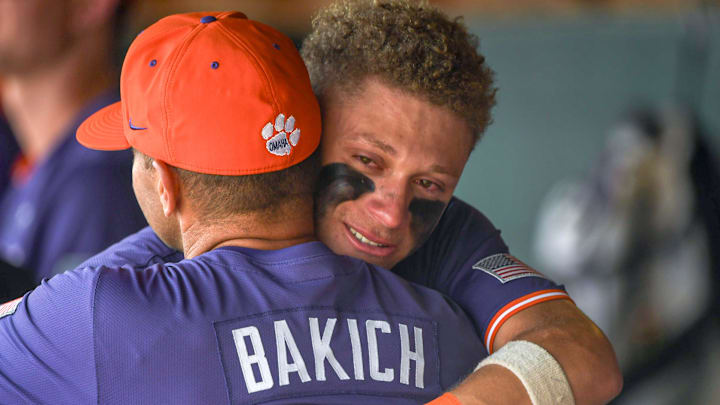 Clemson Head Coach Erik Bakich gets a hug from Clemson outfielder Cam Cannarella (10) after the NCAA baseball Clemson Regional at Doug Kingsmore Stadium in Clemson, S.C. Sunday, June 1, 2025. Kentucky won 16-4, ending Clemson's season.
