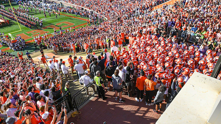 Clemson players run down the hill before the game with UNC, during senior day ceremonies, Nov 18, 2023; Clemson, South Carolina, USA; at Memorial Stadium.