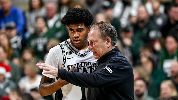 Michigan State's Jase Richardson, left, talks with head coach Tom Izzo during a break in the action in the game against Florida Atlantic on Saturday, Dec. 21, 2024, in East Lansing.