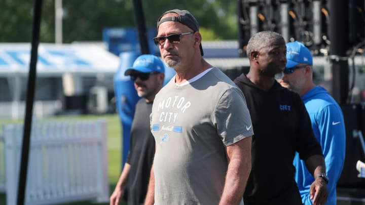 Chris Spielman, special assistant to the owner and CEO for the Detroit Lions walks off the field after practice.