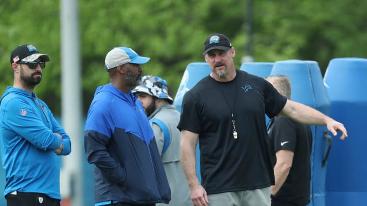 Detroit Lions GM Brad Holmes talks with head coach Dan Campbell 