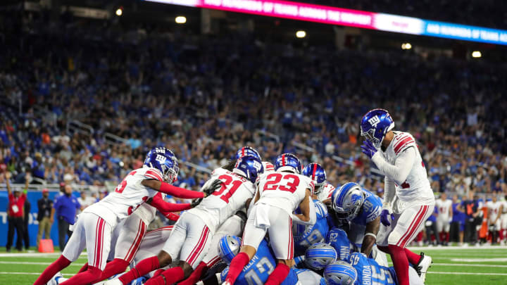 Detroit Lions quarterback Adrian Martinez (18) runs for a touchdown against New York Giants.