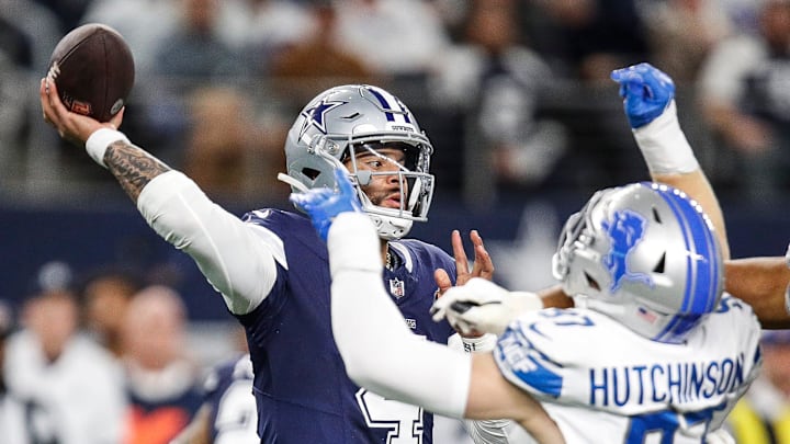 Lions defensive end Aidan Hutchinson tries to tackle Cowboys quarterback Dak Prescott during the first half at AT&T Stadium in Arlington, Texas on Saturday, Dec. 30, 2023. Lions defensive end Aidan Hutchinson tries to tackle Cowboys quarterback Dak Prescott during the first half at AT&T Stadium in Arlington, Texas on Saturday, Dec. 30, 2023.
