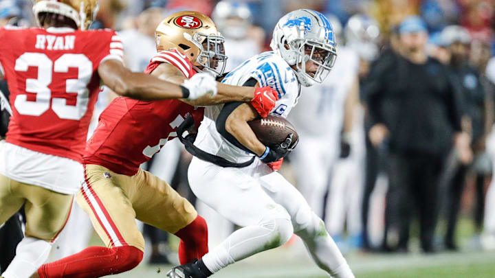 Lions wide receiver Amon-Ra St. Brown makes a catch against 49ers cornerback Charvarius Ward.