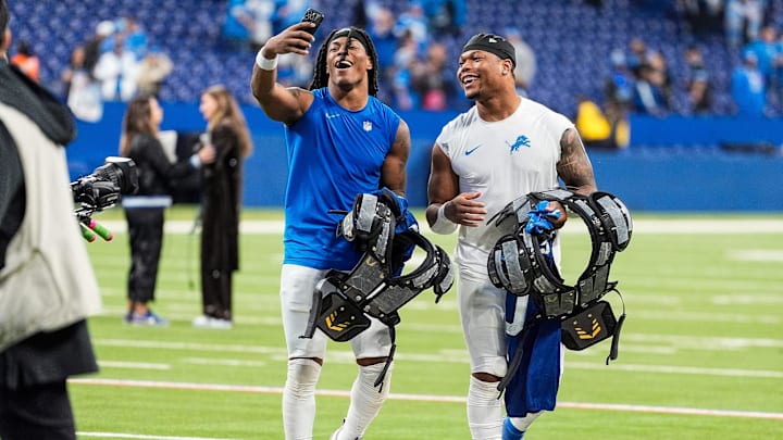 Detroit Lions running back Jahmyr Gibbs (26), left, and running back David Montgomery (5).
