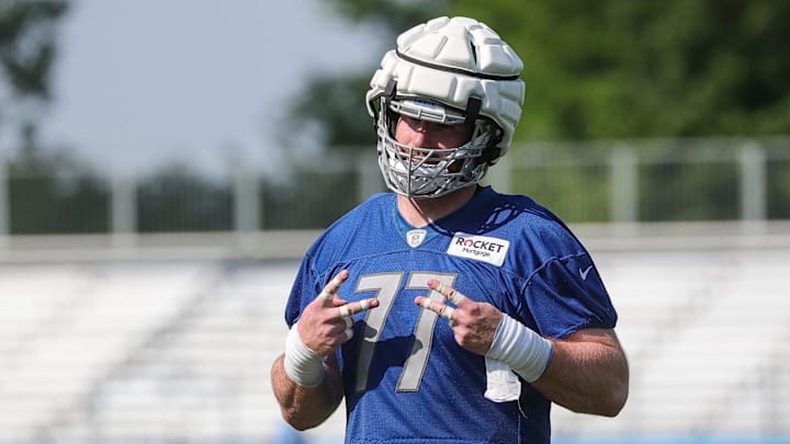 Detroit Lions center Frank Ragnow walks off the field after practice during training camp at the Detroit Lions Headquarters and Training Facility in Allen Park on Sunday, July 23, 2023.