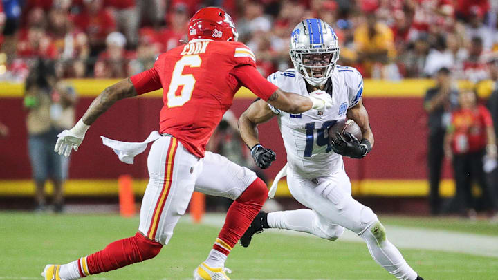 Detroit Lions wide receiver Amon-Ra St. Brown (14) makes a catch against Kansas City Chiefs safety Bryan Cook (6) during the second half at Arrowhead Stadium in Kansas City, Mo. on Thursday, Sept. 7, 2023.