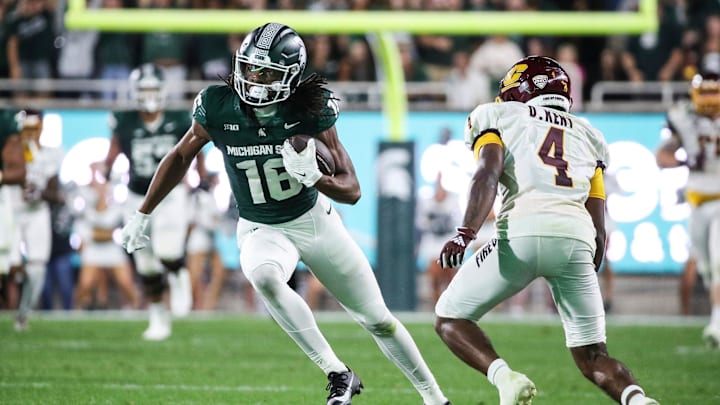 Michigan State wide receiver Christian Fitzpatrick (16) runs against Central Michigan defensive back Donte Kent (4) during the second half at Spartan Stadium in East Lansing on Friday, Sept. 1, 2023.