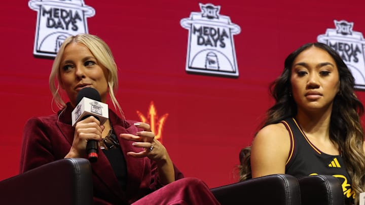 Oct 21, 2025; Kansas City, MO, USA; Arizona State head coach Molly Miller (left) alongside Last-Tear Poa (right) speaks to media during Big 12 Womenís Basketball Media Day at T-Mobile Center. Mandatory Credit: Sophia Scheller-Imagn Images