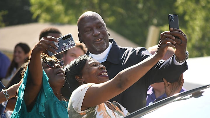 Michael Jordan takes a few photos with friends outside of The Michael Jordan Family Medical Clinic led by Novant Health. After taking part in a ribbon cutting ceremony for the new clinic opening off of Greenfield Street Tuesday May 7, 2024 in Wilmington, N.C. KEN BLEVINS/STARNEWS