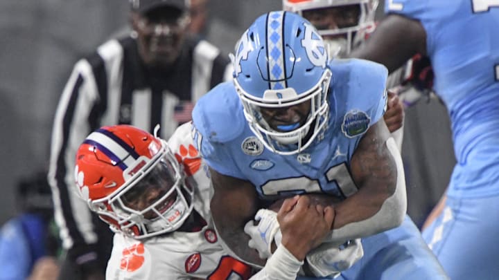 Clemson linebacker Trenton Simpson (22) tackles North Carolina running back Elijah Green (21) during the second quarter of the ACC Championship football game at Bank of America Stadium in Charlotte, North Carolina Saturday, Dec 3, 2022 Clemson linebacker Trenton Simpson (22) tackles North Carolina running back Elijah Green (21) during the second quarter of the ACC Championship football game at Bank of America Stadium in Charlotte, North Carolina Saturday, Dec 3, 2022