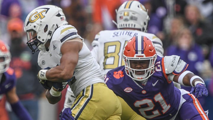 Clemson linebacker Kobe McCloud (21) tackles Georgia Tech running back Dontae Smith (4) during the third quarter Nov 11, 2023; Clemson, South Carolina, USA; at Memorial Stadium.