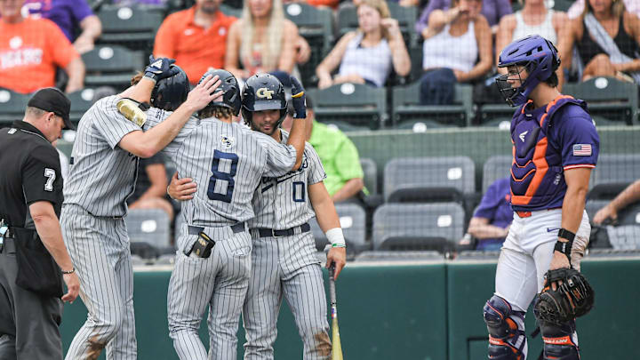 Georgia Tech freshman Drew Burgess (8) is congratulated by teammates near Clemson senior Jimmy Obertop (11) after his home run during the top of the eighth inning of game 2 at Doug Kingsmore Stadium in Clemson Friday, May 3, 2024.