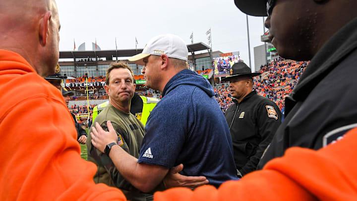 Nov 11, 2023; Clemson, South Carolina, USA; Clemson Tigers head coach Dabo Swinney shakes hands with Georgia Tech Yellow Jackets head coach Brent Key after defeating the Yellow Jackets at Memorial Stadium. Mandatory Credit: Ken Ruinard-Imagn Images