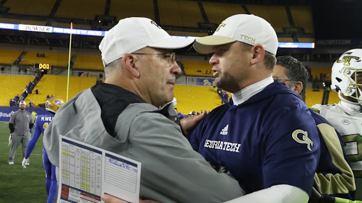 Oct 1, 2022; Pittsburgh, Pennsylvania, USA;  Pittsburgh Panthers head coach Pat Narduzzi (left) and Georgia Tech Yellow Jackets interim head coach Breny Kay (right) meet at mid-field after their game at Acrisure Stadium.  Mandatory Credit: Charles LeClaire-Imagn Images