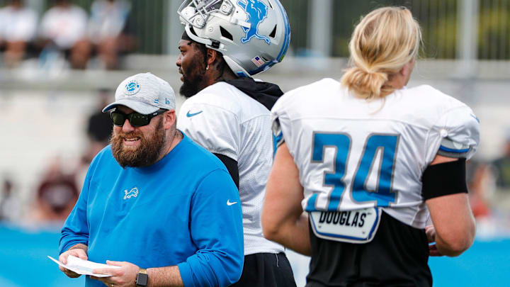 Detroit Lions inside linebacker coach Mark Deleone talks to players during training camp at practice facility in Allen Park, Tuesday, August 10, 2021.