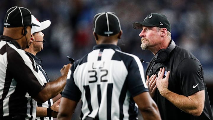 Lions coach Dan Campbell talks to referee Brad Allen regarding offensive tackle Taylor Decker's 2-point conversion catch being called illegal touching during the second half of the Lions' 20-19 loss to the Cowboys at AT&T Stadium in Arlington, Texas on Saturday, Dec. 30, 2023.