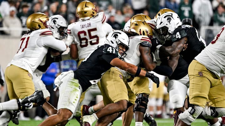 Michigan State's David Santiago, left, tackles Boston College's Turbo Richard during the second quarter on Saturday, Sept. 6, 2025, at Spartan Stadium in East Lansing.