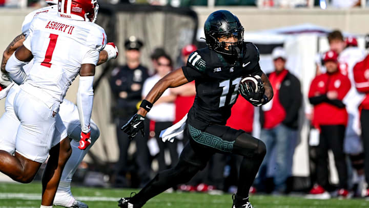 Michigan State's Aziah Johnson runs for a gain against Indiana Michigan State's Aziah Johnson runs for a gain against Indiana