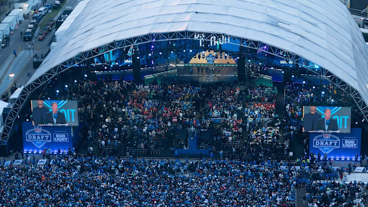 Apr 25, 2025; Detroit, MI, USA; NFL commissioner Roger Goodell brings up local music artist Eminem and some Detroit Lions players on the main theater stage on Thursday, April 25, 2024 for the first day of the NFL Draft in Detroit. Mandatory Credit: Mandi Wright-Imagn Images