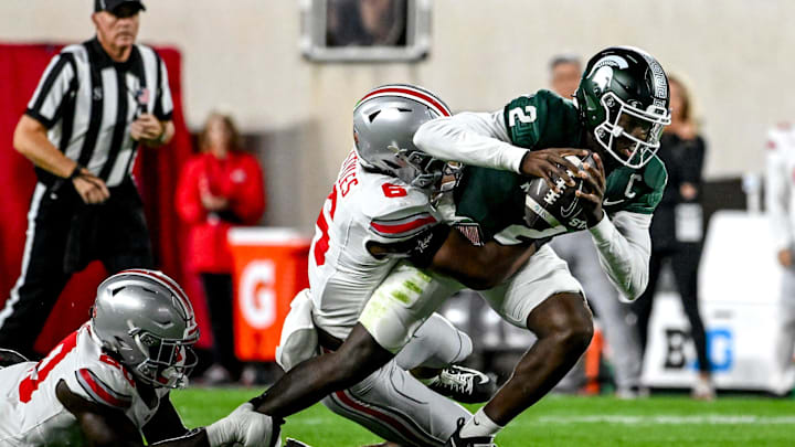 Michigan State's Aidan Chiles, right, is tackled by Ohio State's Sonny Styles during the first quarter on Saturday, Sept. 28, 2024, at Spartan Stadium in East Lansing.