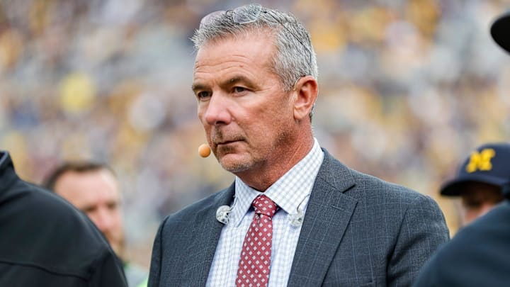 FOX Sports college football analyst Urban Meyer walks along the sideline before a game between Michigan and Maryland at Michigan Stadium in Ann Arbor on Saturday, Sept. 24, 2022.