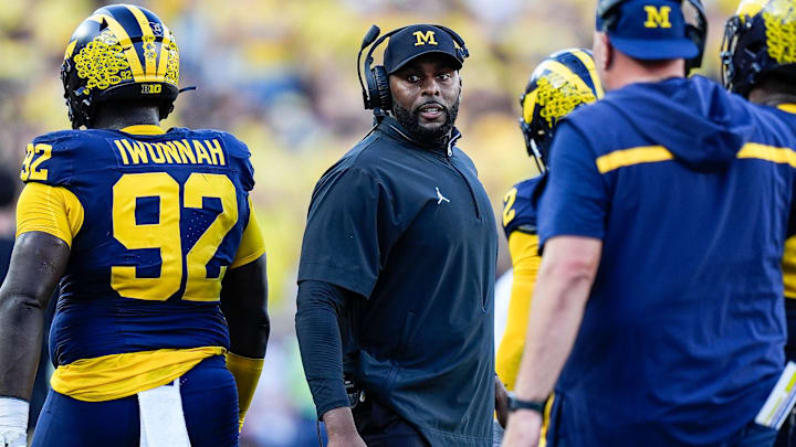 Michigan head coach Sherrone Moore talks to players at a timeout against USC during the second half at Michigan Stadium in Ann Arbor on Saturday, Sept. 21, 2024. Michigan head coach Sherrone Moore talks to players at a timeout against USC during the second half at Michigan Stadium in Ann Arbor on Saturday, Sept. 21, 2024.