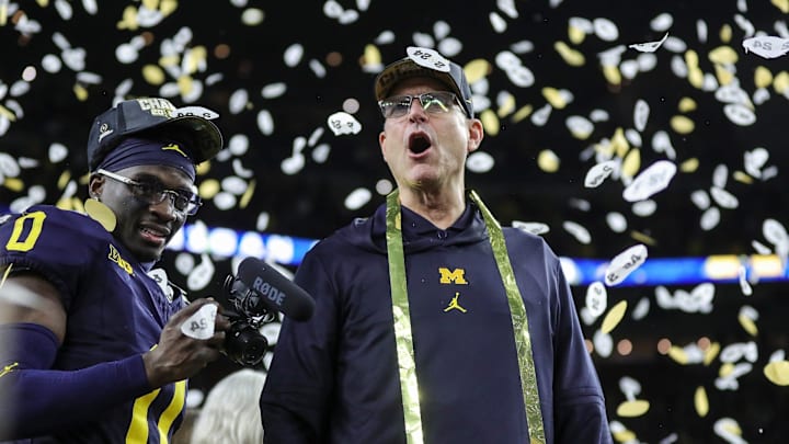 Michigan head coach Jim Harbaugh celebrates during the trophy presentation after the 34-13 win over Washington at the national championship game at NRG Stadium in Houston on Monday, Jan. 8, 2024. Michigan head coach Jim Harbaugh celebrates during the trophy presentation after the 34-13 win over Washington at the national championship game at NRG Stadium in Houston on Monday, Jan. 8, 2024.