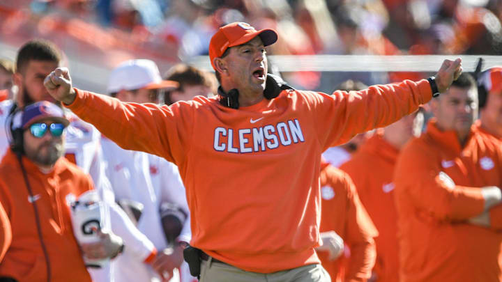 Clemson head coach Dabo Swinney coaches during a college football game in the ACC. Clemson head coach Dabo Swinney coaches during a college football game in the ACC.